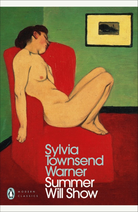 Woman reclining on red couch